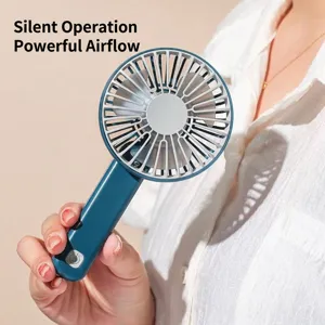 Mini ventilador USB portátil en azul oscuro, sostenido en la mano para el verano