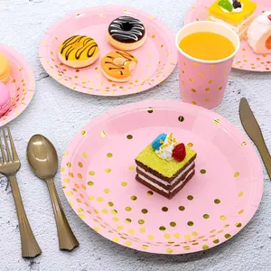 Pink disposable party tableware set with gold polka dots for birthdays and picnics