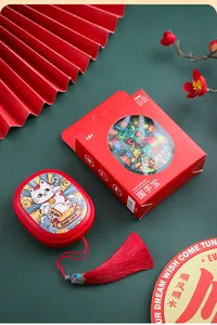 Portable rechargeable hand warmer with lucky cat design and festive gift box.