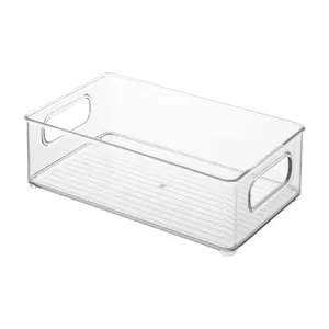 Contenedor de almacenamiento acrílico transparente con asas y fondo estriado para el hogar.