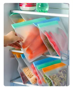 Detail showing reusable EVA food storage bags with colored slide seals in a refrigerator