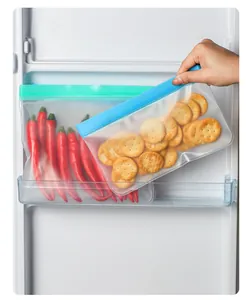 Translucent reusable EVA food storage bags for crackers and peppers inside a refrigerator