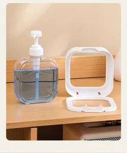 Vue détaillée d'un flacon distributeur transparent avec cadre de montage blanc
