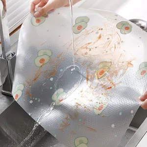 Waterproof avocado pattern kitchen drawer mat being washed under running water in sink
