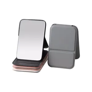 Portable folding makeup mirror with faux leather cover and adjustable desktop stand