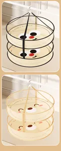 Detail view of two 3-tier hanging mesh drying baskets featuring cute cartoon face designs
