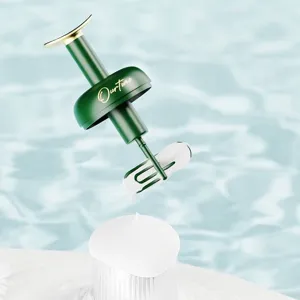 Portable manual foam maker for facial cleanser with ergonomic green and gold design