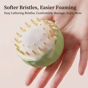 Ergonomic silicone scalp massage brush for hair washing with soft bristles in green