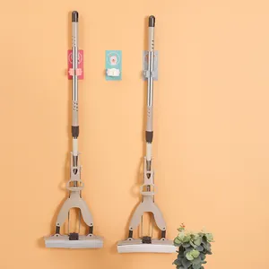 Self-adhesive cartoon mop hooks for wall-mounted storage showing two mops hanging