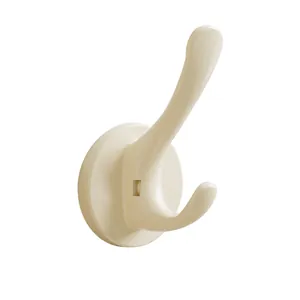 Cream-colored suction cup wall hook for hanging clothes and accessories