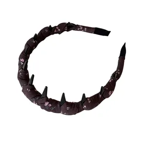 Vintage brown floral fabric wrapped headband with unique height-increasing spiked design