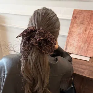 Chouchou rétro imprimé léopard avec nœud pour femme, accessoire élégant pour queue de cheval