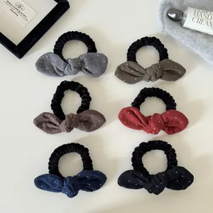 Set van 6 stippen haarelastiekjes met konijnenoren strik in herfstkleuren.