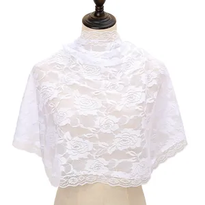 Close-up of elegant white floral lace wedding veil with delicate scalloped edges.