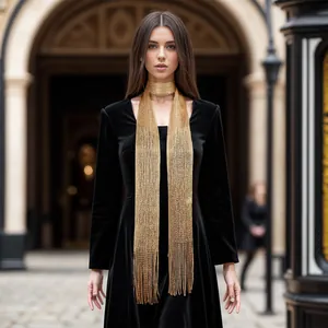 Elegant gold metallic mesh streamer scarf for women styled with a black velvet dress.