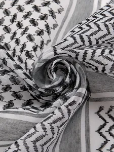Macro detail of black and white jacquard checkered keffiyeh scarf texture