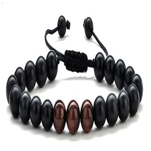 Detailed view of the black and reddish-brown tiger eye bead bracelet with braided cord.