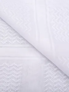 Macro view of white jacquard fabric with chevron and check patterns for a shemagh scarf
