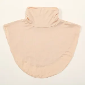 Detail view of skin-toned women's knitted mock neck dickey for extra winter warmth