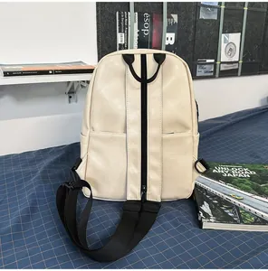 Detailed back view of minimalist cream PU leather backpack for students and leisure travel