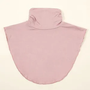 Detailed view of dusty pink knitted high-neck false collar for winter warmth