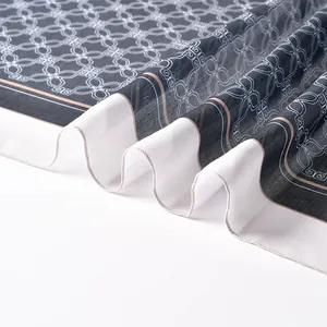 Macro view of high-quality polyester printed square scarf with fine overlocked edges