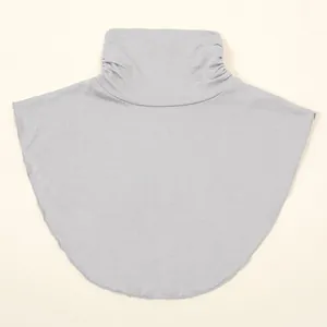 Detailed view of women's gray knitted mock turtleneck dickey collar for winter warmth