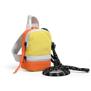 Compact orange and yellow mini pouch for earbuds and coins with black patterned lanyard