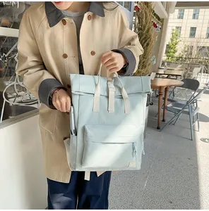Casual mint green lightweight travel backpack for men shown in an outdoor lifestyle setting