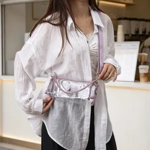 Stylish transparent PVC crossbody bag for women with purple rhinestone chain detail