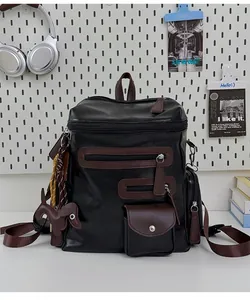 Vintage black PU leather backpack with brown zipper details and cute dog charm