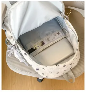 Detailed view of the star print backpack interior with laptop compartment and pockets