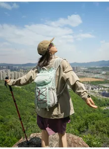 Lightweight mint green outdoor hiking backpack with ergonomic breathable mesh straps.