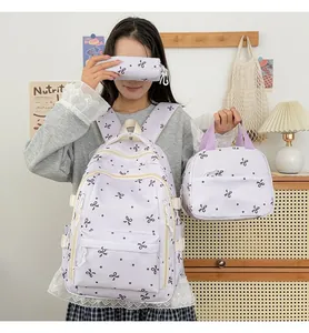 Ensemble de sac à dos trois pièces lavande avec motifs nœuds, sac à main et trousse