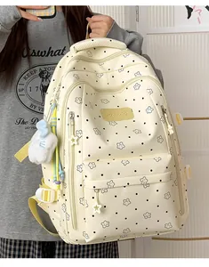Süßer cremefarbener Rucksack mit schwarzen Punkten und Blumenmuster Detailansicht für Schüler