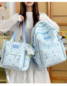 Cute light blue backpack and tote bag set featuring white star patterns and plush charm