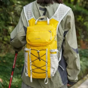 Professional lightweight yellow outdoor hiking backpack featuring bungee cord storage system