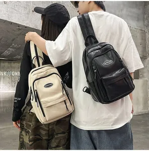 Close-up detail of black and cream PU leather minimalist leisure backpacks worn by models