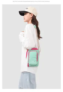 Korean style mint green crossbody phone bag with multi-colored braided strap