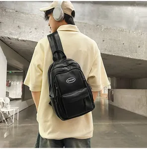 Rear view detail of black faux leather minimalist backpack for students and travel