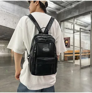 Back view of a minimalist black PU leather backpack styled for travel and school use