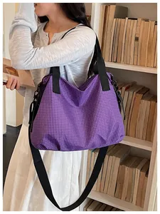 Large capacity purple checkered nylon tote bag worn on shoulder in a library.