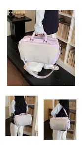 Detailed view of lavender travel bag shown in hand-held and shoulder-carry lifestyle modes.