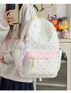 Cute Japanese style polka dot backpack with lace bows for school, campus and travel