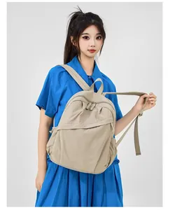 Korean style beige nylon backpack shown on Asian model for daily commuting use