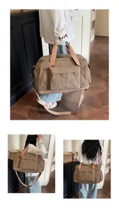 Large capacity checkered travel duffle bag for gym and business trips shown in use