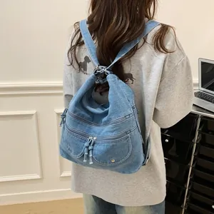 Vintage blue denim backpack with multi-zipper pockets for students and daily commute