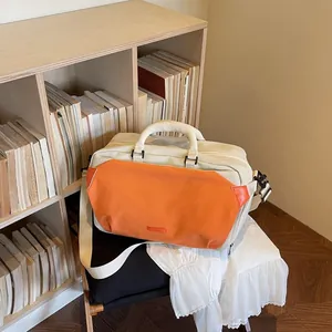 Minimalist cream and orange unisex travel bag for outdoor sports and short trips