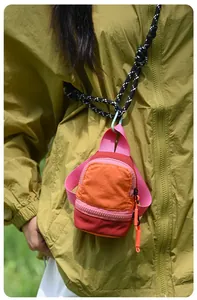 Detail view of mini colorful outdoor storage pouch for earphones and lipstick with lanyard