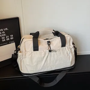 Beige large capacity travel gym bag with black straps and dry-wet separation compartments